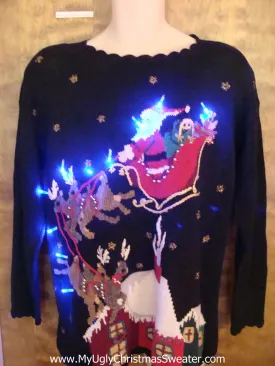 Santa and Reindeer Landing on a House Light Up Ugly Xmas Sweater