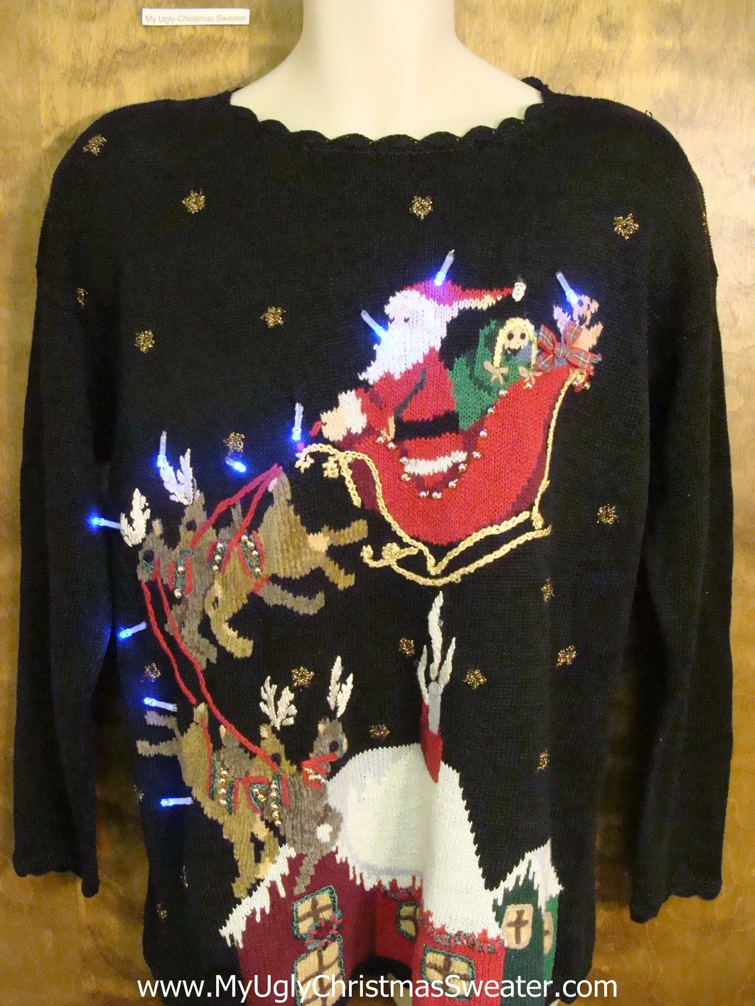 Santa and Reindeer Landing on a House Light Up Ugly Xmas Sweater